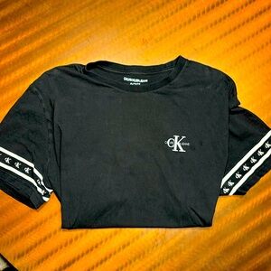 Calvin Klein Jeans T -Shirt - Color: Black - “CK” Branded arm Sleeves - XL -